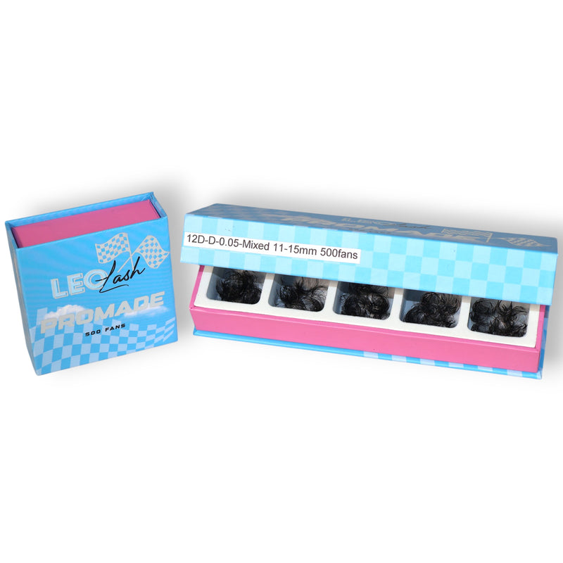 A box of false eyelashes with multiple compartments showing different sizes of lashes.