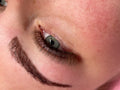 Close-up of premium lash extensions on natural lashes, Leo Lash Range, clear skin detail