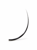 A single black curved hair extension or lash piece photographed on a clean white studio background.