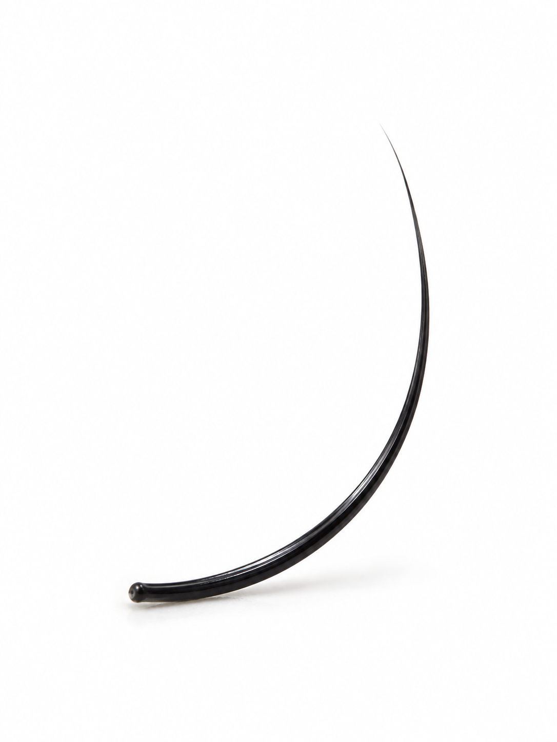 A single black curved hair extension or lash piece photographed on a clean white studio background.