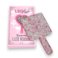 Leo Lash Enchanted Lash Mirror with pink and silver rhinestones on pink packaging.