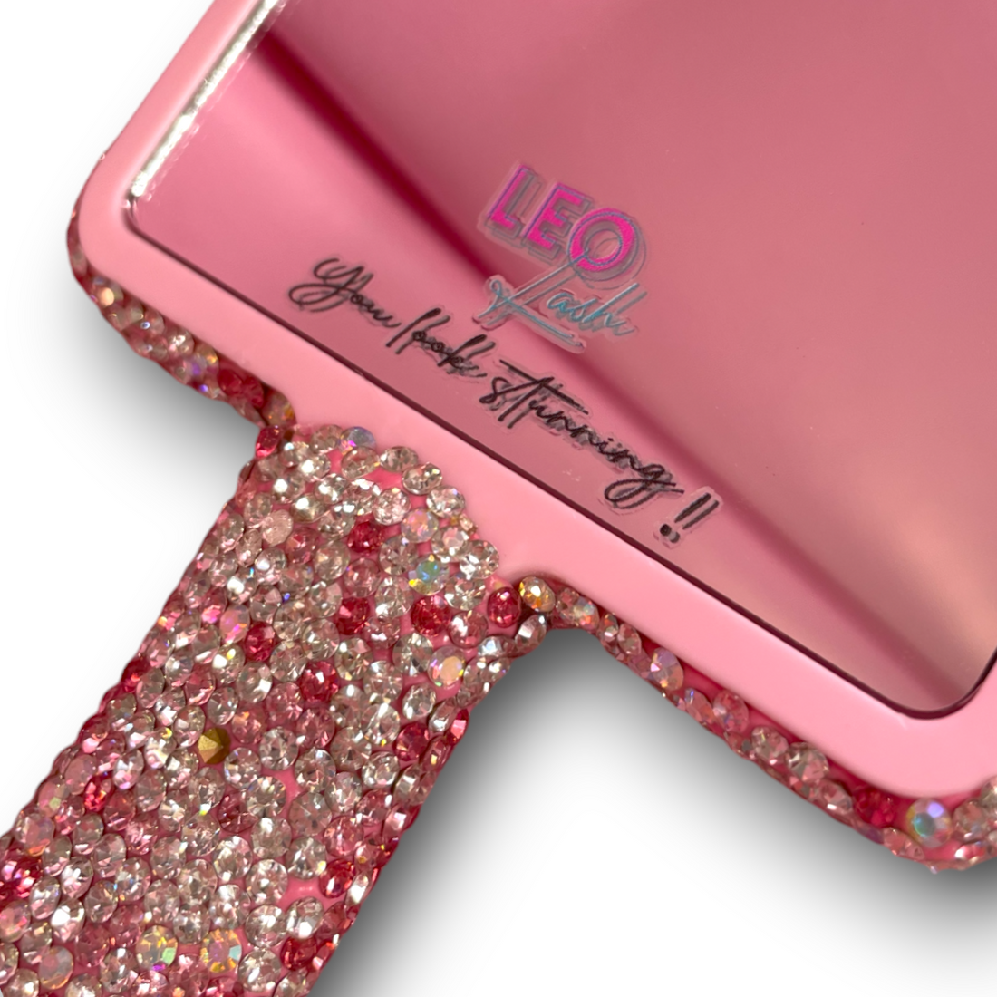 Leo Lash Enchanted Lash Mirror with pink and silver rhinestones on pink packaging.